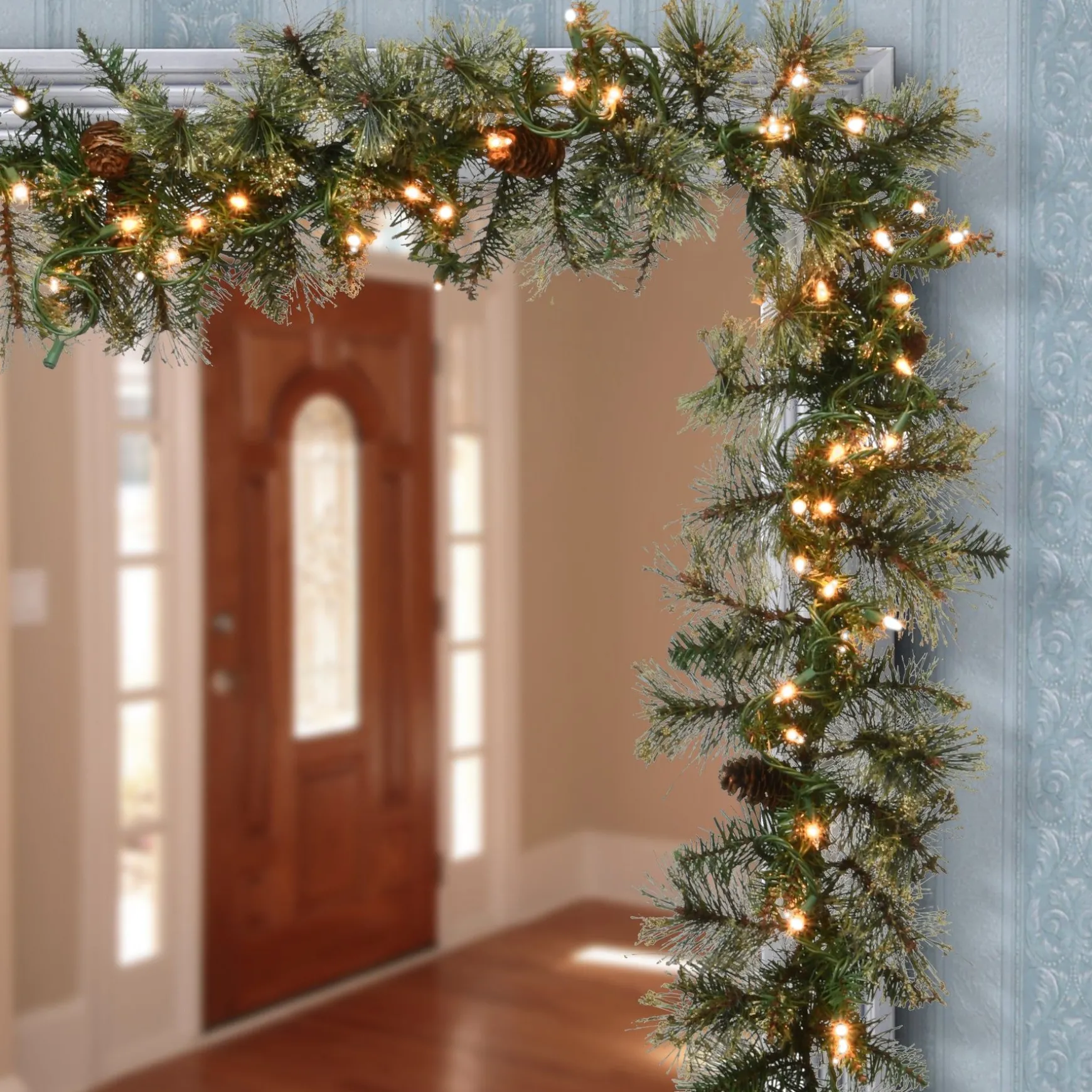 Fashion National Tree Company Pre-Lit Artificial Christmas Garland, Green, Golden Bristle, White Lights, Decorated With Pine Cones, Plug In, Christmas Collection, 9 Feet