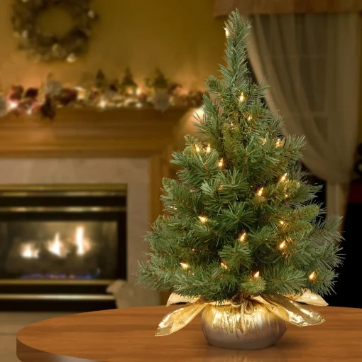 Fashion National Tree Company Pre-Lit Artificial Christmas Tree, Majestic Fir, Green, White Lights, Includes Gold Cloth Base, 2 Feet