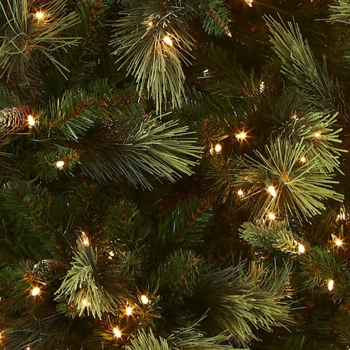 Fashion National Tree Company Pre-Lit Artificial Full Christmas Tree, Green, Carolina Pine, White Lights, Flocked With Pine Cones, Includes Stand, 7.5 Feet