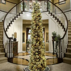 Online National Tree Company Pre-Lit Artificial Giant Slim Christmas Tree, Green, Carolina Pine, White Lights, Flocked With Pine Cones, Includes Stand, 12 Feet