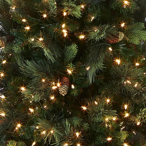 Online National Tree Company Pre-Lit Artificial Giant Slim Christmas Tree, Green, Carolina Pine, White Lights, Flocked With Pine Cones, Includes Stand, 12 Feet